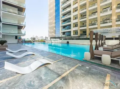 a swimming pool in the middle of a building at Pristine 1BR at Binghatti Creek Al Jadaf by Deluxe Holiday Homes in Dubai