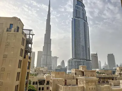 a view of a city with two tall buildings at Burj Royale - Classic One Bedroom in Dubai