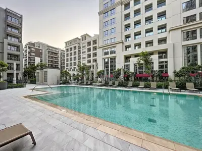 a large swimming pool in the middle of a building at Vacationer I Premium One Bed with Skyline Views I Summer Creek Beach Tower 2, Dubai Creek Harbour in Dubai