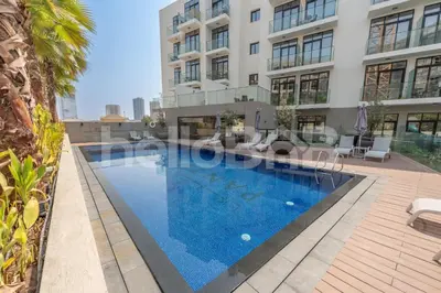a swimming pool in the middle of a building at Le Petit Village !Cozy Yet Spacious Studio Apartment! in Dubai
