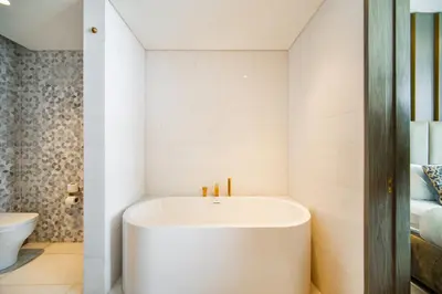 a bathroom with a white tub in a room at Five Palm Super Luxury Apt with Full Sea Views in Dubai