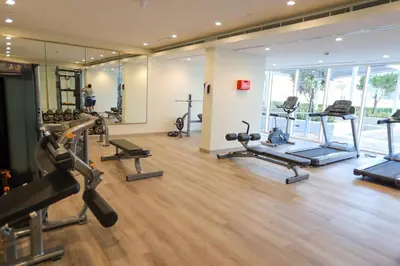 a gym with a bunch of exercise equipment in a room at Reva tower- 2BR Dubai mall walking & canal facing in Dubai