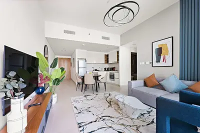 a living room with a couch and a table at Silkhaus chic 1BDR in the heart of Downtown in new tower in Dubai