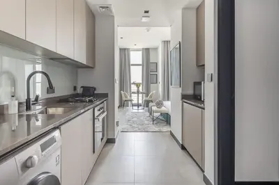 a kitchen with a sink and a counter top at Frank Porter - 15 Northside Tower 1 in Dubai