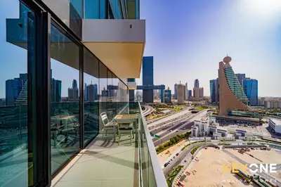 a balcony with a view of a city skyline at Pristine Cozy One Bedroom Suite in Dubai