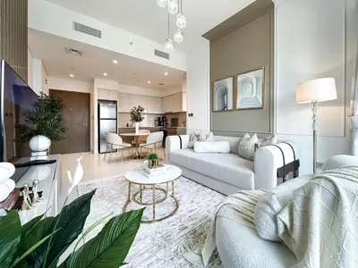 a living room with a couch and a table at Trophy - Euphoria Eclipse Suite in 29th floor in Burj Royale in Dubai