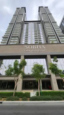 a tall building with trees in front of it at STAY BY LATINEM Luxury 1BR Holiday Home CVR A703 near Burj Khalifa in Dubai