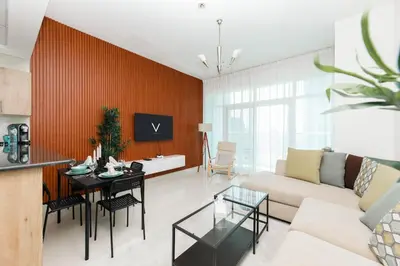 a living room with a couch and a table at Waterfront With Stunning View! in Dubai