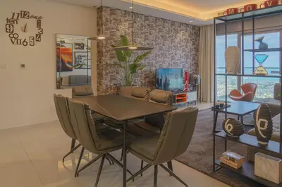 a dining room with a table and chairs at Paramount Tower Hotel and Residences with Infinity Sky Pool in Dubai
