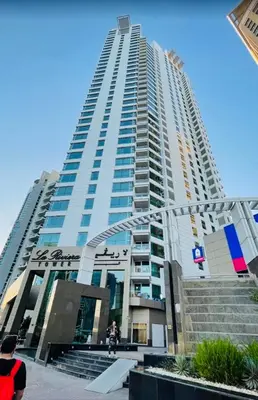 a tall building with stairs in front of it at Dubai Marina larivera in Dubai