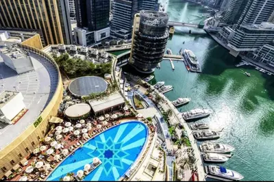 a view of a marina with boats in the water at Dubai Marina larivera in Dubai