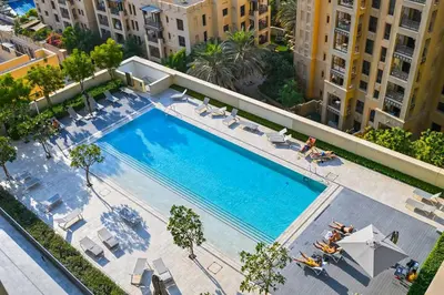 an overhead view of a swimming pool in a building at Vogue Downtown Burj Royale near Dubai Mall and Burj Khalifa ,Two Bedroom Apartment with large Balcony and Access to all Amenities in Dubai
