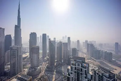 an aerial view of a city with tall buildings at Elegant apartment in Paramount Midtown residence in Dubai