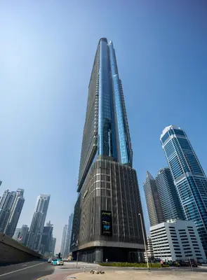 a tall building in a city with tall buildings at Elegant apartment in Paramount Midtown residence in Dubai