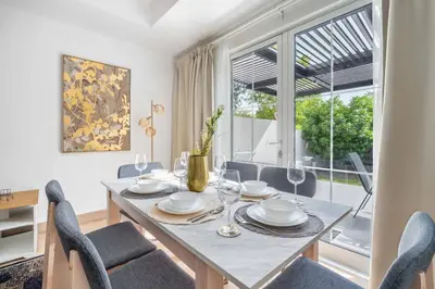 a dining room with a table and chairs and a window at GuestReady - Springs Serenity near Golf Club in Dubai