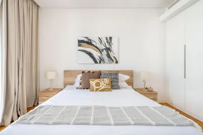 a bedroom with a large white bed with pillows at GuestReady - Majestic Ain Dubai from your balcony in Dubai