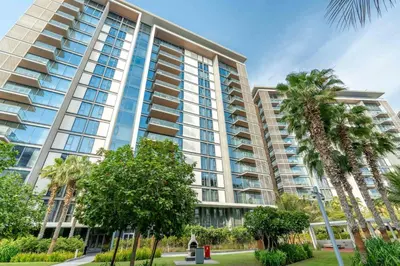 a large building with palm trees in front of it at GuestReady - Majestic Ain Dubai from your balcony in Dubai