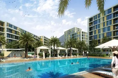 an artist rendering of the pool at the proposed apartments at the resort at Polished 1BR at Noor 1 Midtown Dubai Production City by Deluxe Holiday Homes in Dubai