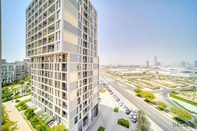 an aerial view of a tall building in a city at Polished 1BR at Noor 1 Midtown Dubai Production City by Deluxe Holiday Homes in Dubai