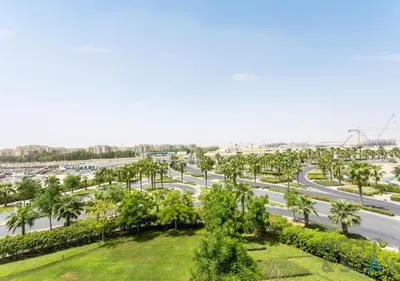 an aerial view of a highway with palm trees at Studio in Jasmine, Damac Hills - Host & Stay in Dubai