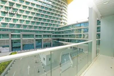 a view of a large building from a balcony at Mira Holiday Homes - Lovely 1 bedroom with beach access in Dubai