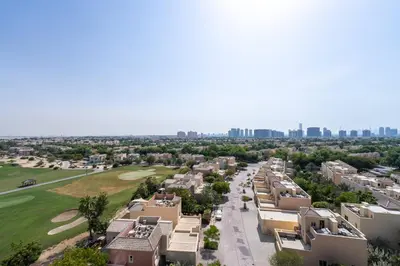 an aerial view of a residential street with buildings at Special Rates - Elegant Studio - Golf Views in Dubai