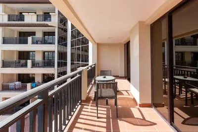 a balcony of a building with a table and chairs at Lux BnB I Palm Jumeirah Resort I Palm Views in Dubai