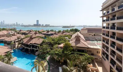 an aerial view of a resort with a swimming pool at Lux BnB I Palm Jumeirah Resort I Palm Views in Dubai
