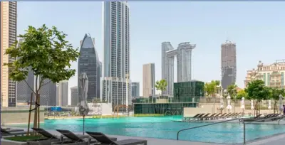 a large swimming pool in a city with buildings at BellaVista Downtown Views II Tower 1 Modern 2BR Downtown City View in Dubai