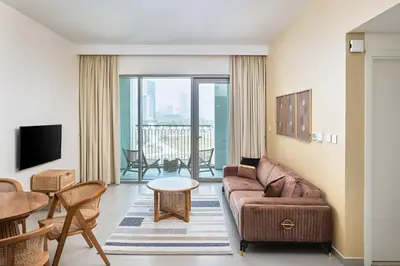 a living room with a couch and a table at BellaVista Downtown Views II Tower 1 Modern 2BR Downtown City View in Dubai