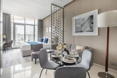 a living room with a couch and a table at Frank Porter - Prive A in Dubai