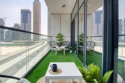 an apartment balcony with a view of the city at GuestReady - A sophisticated and refined dwelling in Dubai