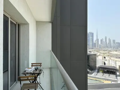 a balcony with a view of a city skyline at Trophy - Maison de Charme Suite in Dubai