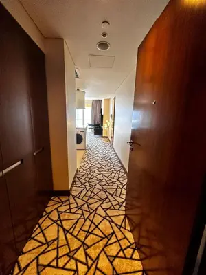 a hallway of a hotel with a tile floor at Fashion Avenue Dubai Mall Burj Khalifa View Residence- Formerly Address Dubai Mall in Dubai