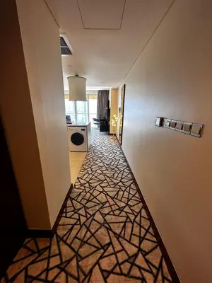 a hallway of a hotel room with a hallwayngth at Fashion Avenue Dubai Mall Burj Khalifa View Residence- Formerly Address Dubai Mall in Dubai
