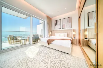 a bedroom with a bed and a large window at Picturesque 3BR with Assistant Room at The One JBR by Deluxe Holiday Homes in Dubai
