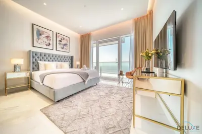 a bedroom with a bed and a large window at Picturesque 3BR with Assistant Room at The One JBR by Deluxe Holiday Homes in Dubai