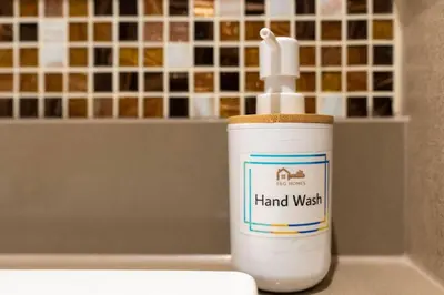 a bottle of hand wash sitting on top of a counter at Serenity Studio in Dubai