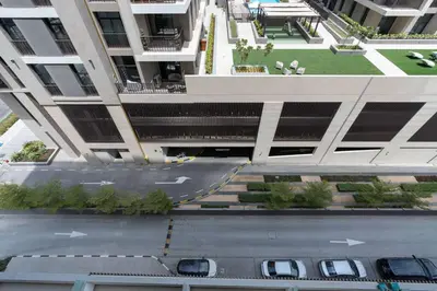 an aerial view of a building with a parking lot at Serenity Studio in Dubai
