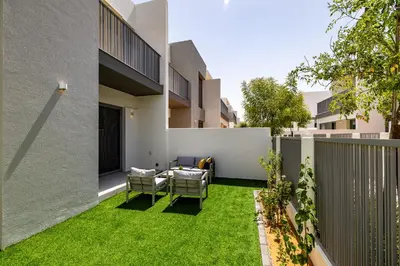 an image of a backyard with green grass at Exclusive Spacious Villa I Garden I Maid Room in Dubai