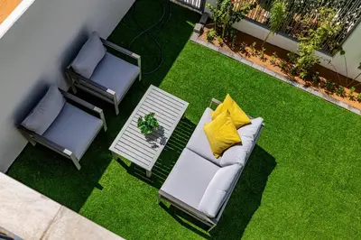 an overhead view of a patio with chairs and a table at Exclusive Spacious Villa I Garden I Tilal Al Ghaf in Dubai