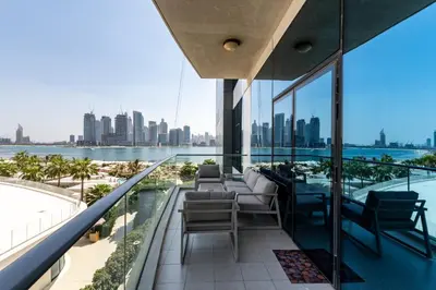 a balcony with chairs and a view of the city at Oceana Residences, Oceana Palm Jumeirah - Mint Stay in Dubai