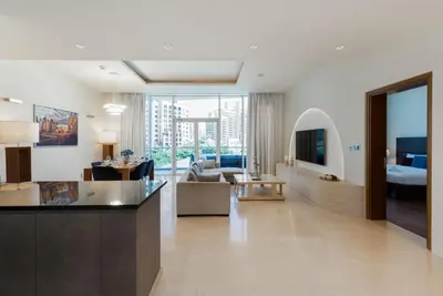 a living room with a couch and a table at Oceana Residences, Oceana Palm Jumeirah - Mint Stay in Dubai