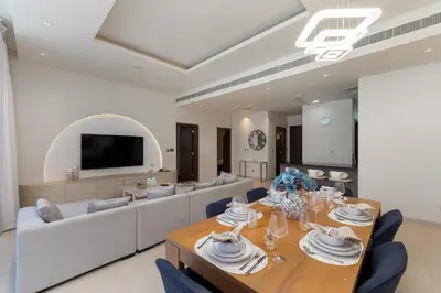 a living room with a table and a couch at Oceana Residences, Oceana Palm Jumeirah - Mint Stay in Dubai