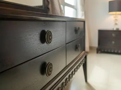 a black dresser with a mirror on top of it at Elegant Apartment Overlooking Dubai Mall Fountain. in Dubai