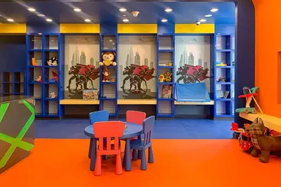 a childs play room with a table and chairs at Frank Porter - DAMAC Artesia in Dubai