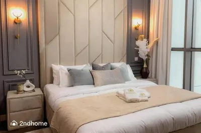 a bedroom with a large bed with two towels on it at Luxurious 1 Bed with Direct Access to Dubai Mall in Dubai