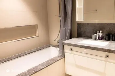 a small kitchen with a sink and a counter at Luxurious 1 Bed with Direct Access to Dubai Mall in Dubai