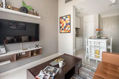 a living room with a couch and a table at Frank Porter - Zada Tower in Dubai