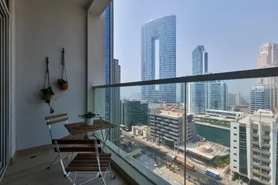 a balcony with a table and a view of a city at Studio With Best View Of Dubai in Dubai